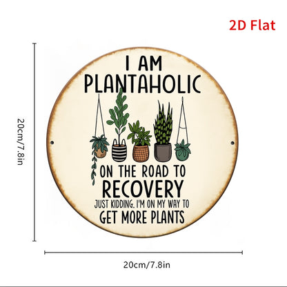 Funny plant lover wall sign with the message I am plantaholic on the road to recovery and potted plants