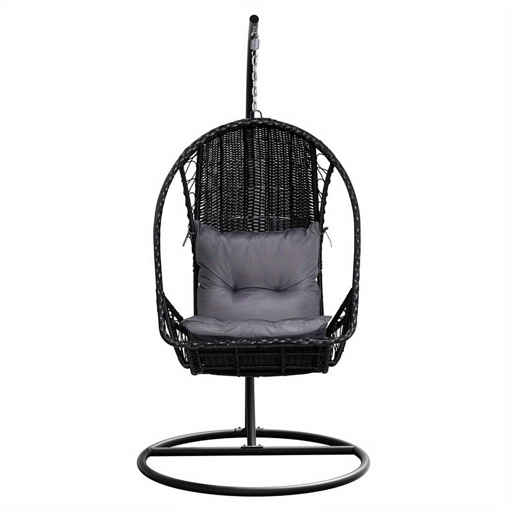 Nutshell outdoor egg chair hammock in black wicker with gray cushion and metal stand for patio