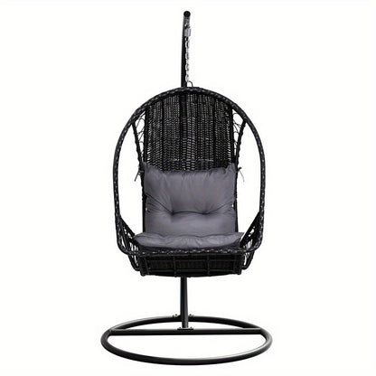 Nutshell outdoor egg chair hammock in black wicker with gray cushion and metal stand for patio