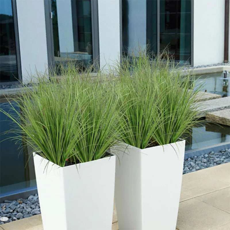 Nutshell Faux onion grass artificial plant in two tall white rectangular planters for modern patio decor