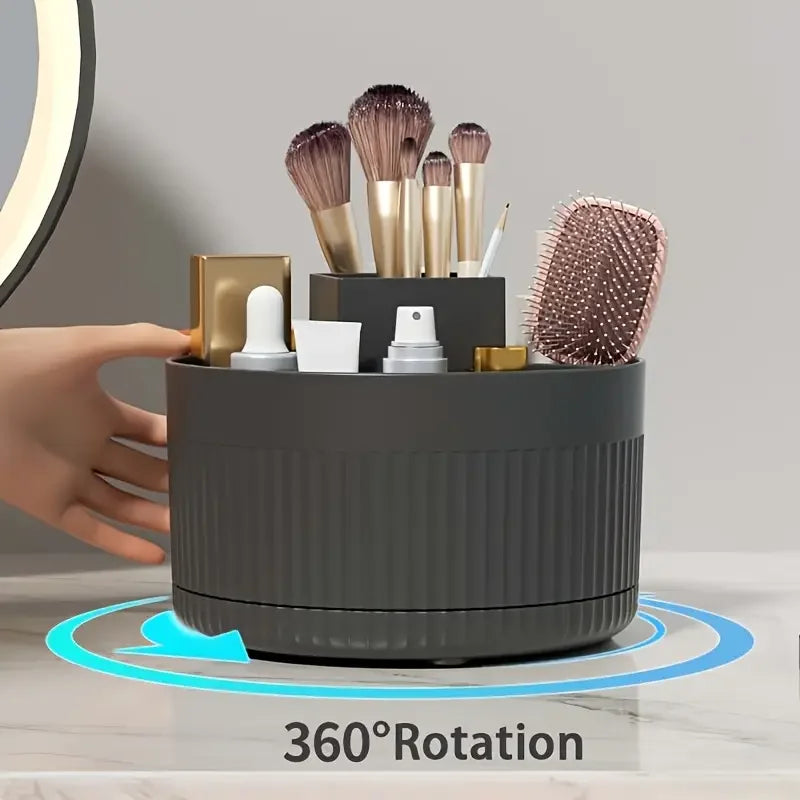 Nutshell 360 degree rotating makeup organizer in black holding brushes and beauty tools on countertop