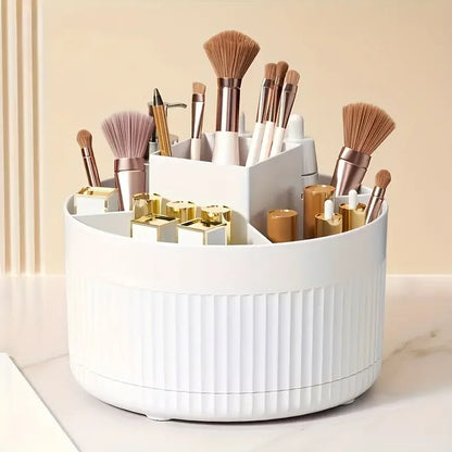 Nutshell 360 degree rotating makeup organizer in white holding makeup brushes and cosmetics
