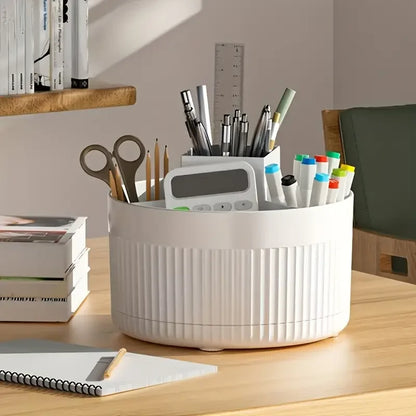 Nutshell 360 degree rotating makeup organizer in white holding pens scissors and markers on desk