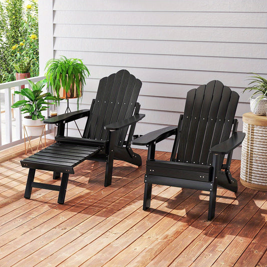 Black adjustable Adirondack chair with footrest on wooden deck surrounded by plants