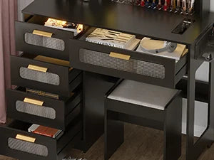 Nutshell makeup vanity desk with lights and mirror in black finish showing multiple drawers and cushioned stool