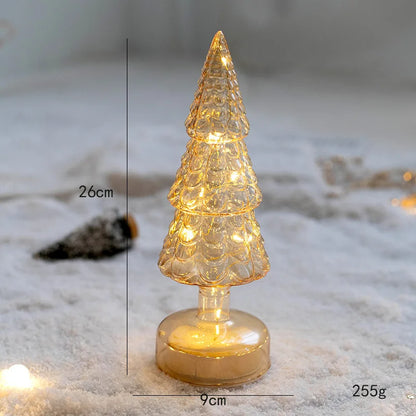 Nutshell glass Christmas tree ornament illuminated with warm lights for festive decor