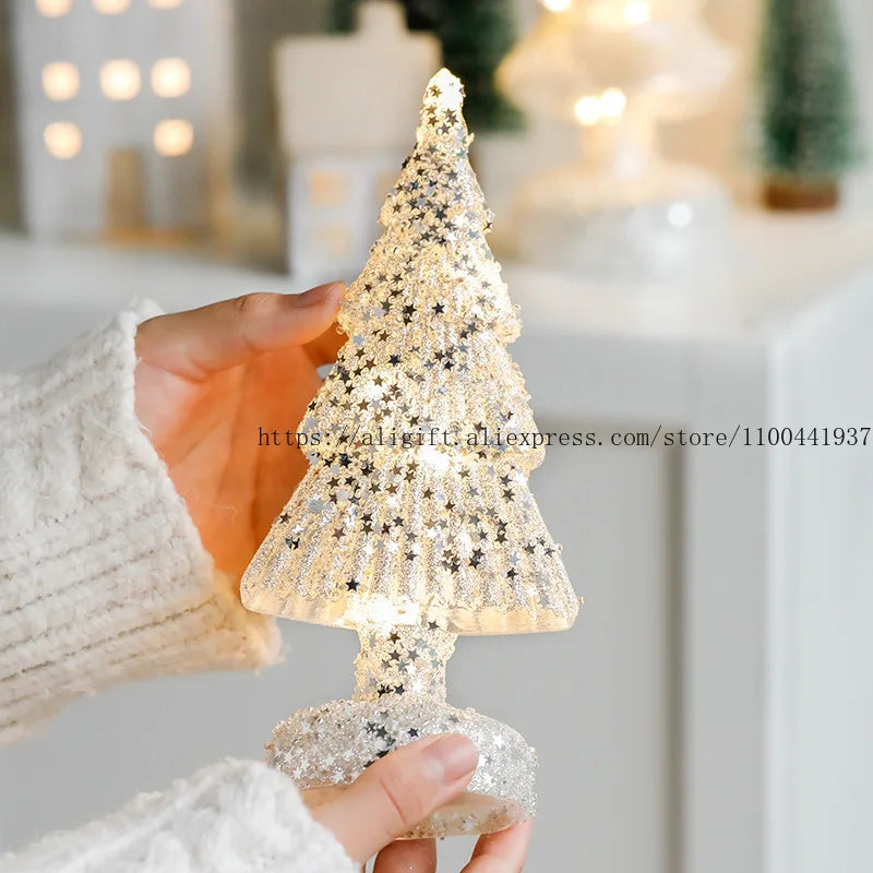 Handcrafted glass Christmas tree ornament with sparkling stars and a glittery base