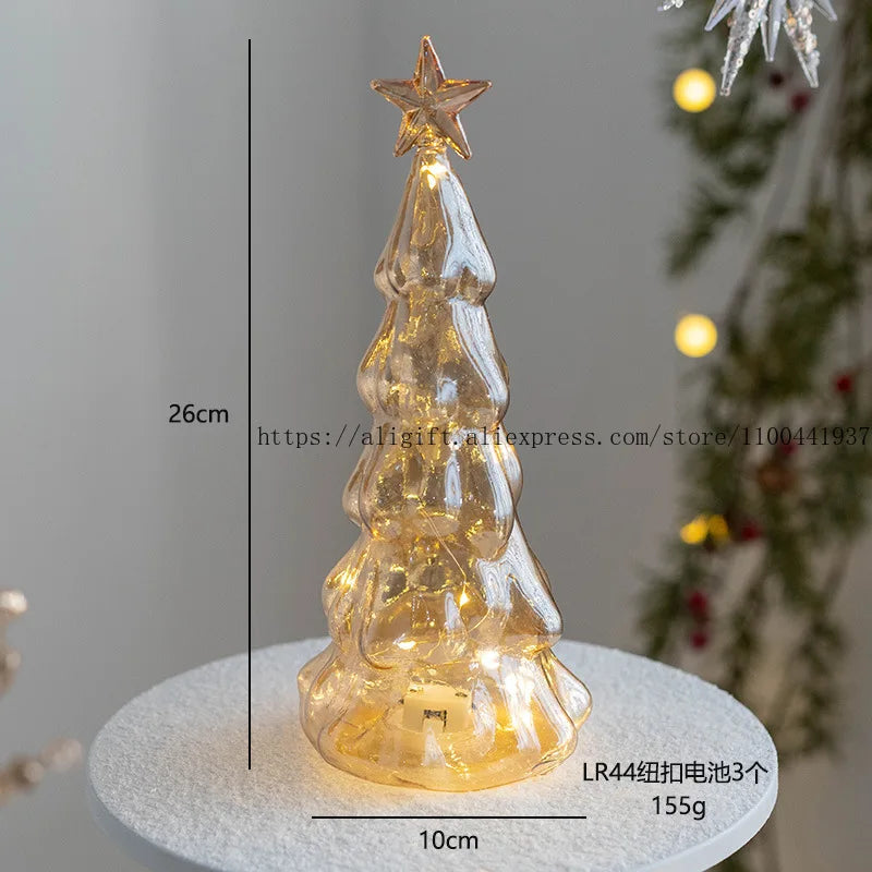 Nutshell glass Christmas tree ornament with a star top and warm LED lights for festive decor