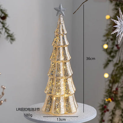 Gold glass Christmas tree ornament with a star top and intricate detailing for holiday decor