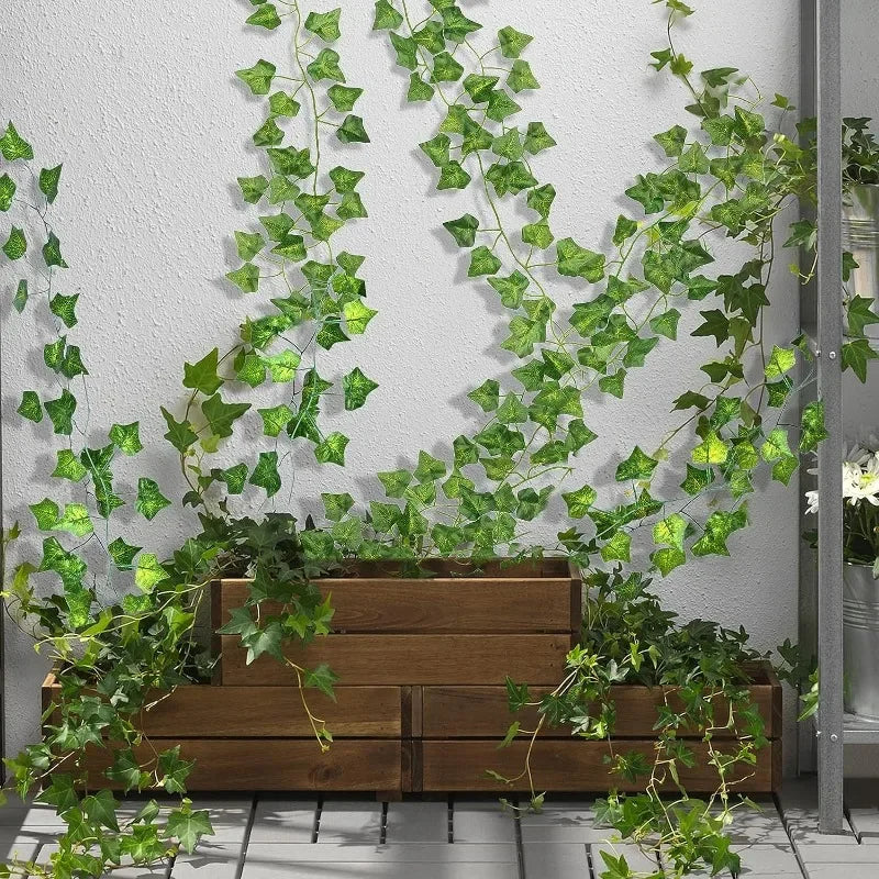Nutshell Artificial Green Ivy Leaf Rattan Creeper Vine draping over wooden planters and wall for indoor decor