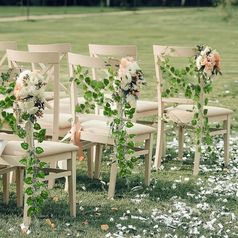 Nutshell faux plants Artificial Green Ivy Leaf Rattan Creeper Vine draped on white ceremony chairs with floral accents