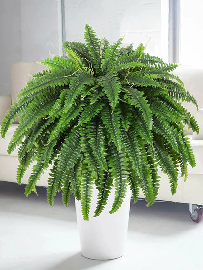 Nutshell artificial fern hanging plant in white planter used as lush living room accent