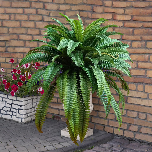 Nutshell artificial fern hanging plant in decorative outdoor urn with lifelike cascading green fronds