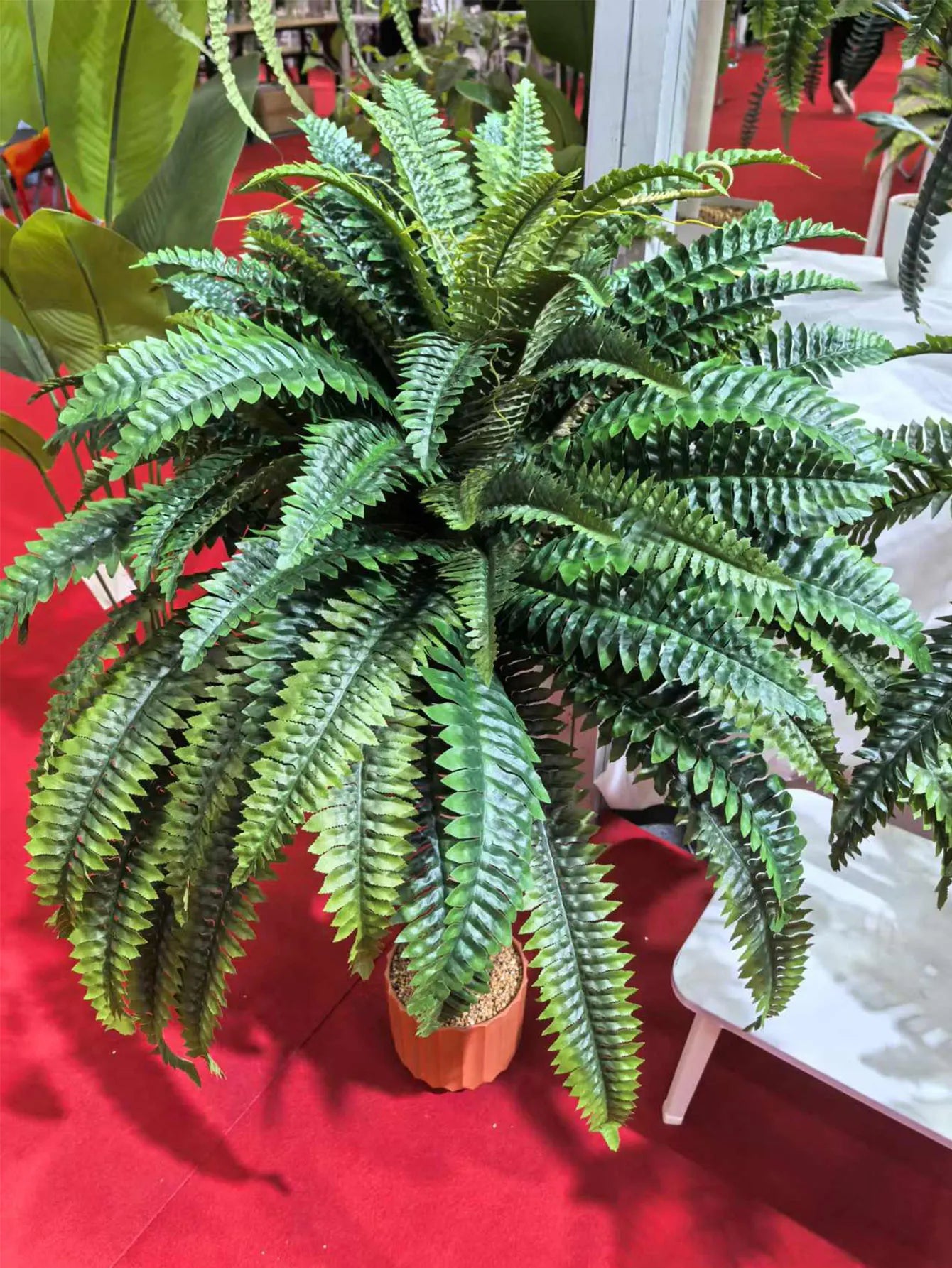 Nutshell artificial fern hanging plant in terracotta pot with lush green fronds for indoor decor