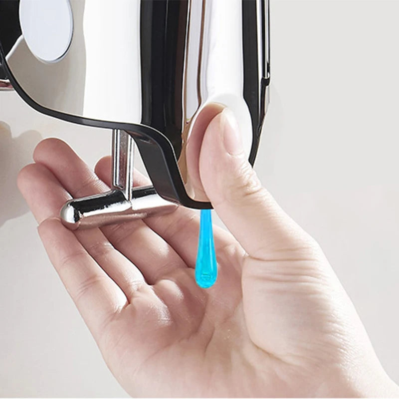 Close-up of Hand Liquid Soap Dispensers dispensing blue liquid soap into a hand