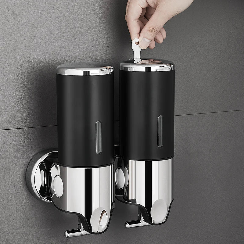 Nutshell Hand Liquid Soap Dispensers mounted on a wall with a hand using a key to unlock