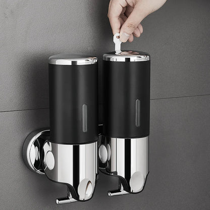 Nutshell Hand Liquid Soap Dispensers mounted on a wall with a hand using a key to unlock