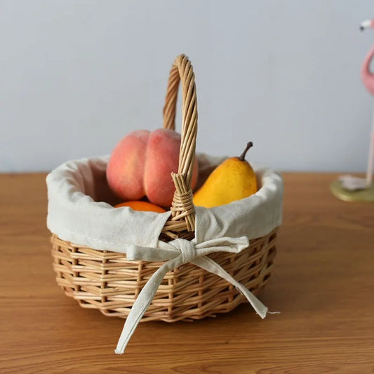 Nutshell handcrafted wicker basket with fabric lining holding assorted fresh fruit on wooden surface