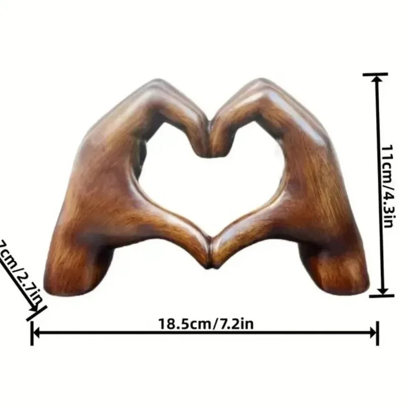 Heart-shaped resin sculpture decor featuring two hands forming a heart shape for unique home decor