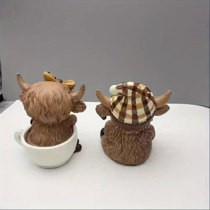 Cute highland cow coffee decor figurines in teacups, perfect for farmhouse or cottage decoration