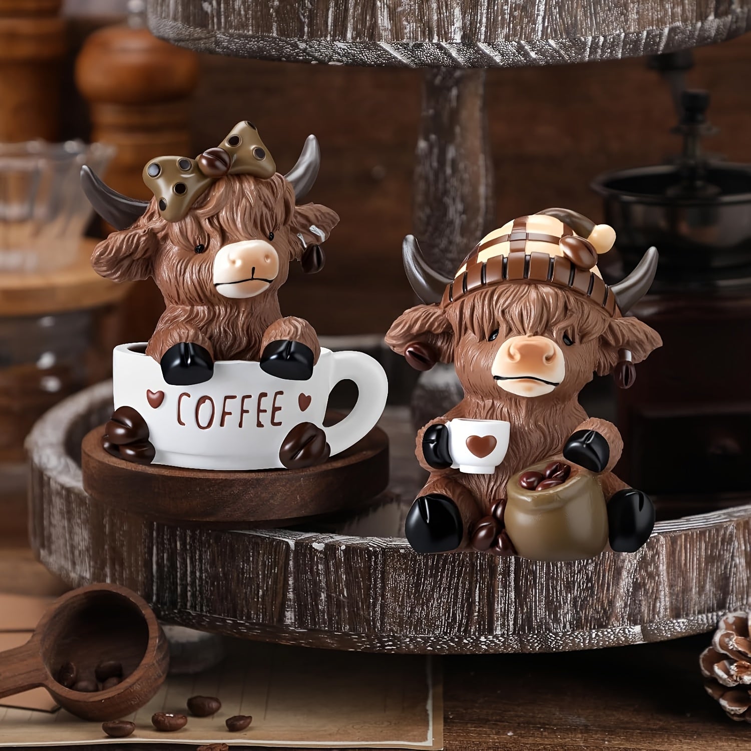 Highland cow coffee decor figurines sitting on a wooden shelf with coffee elements