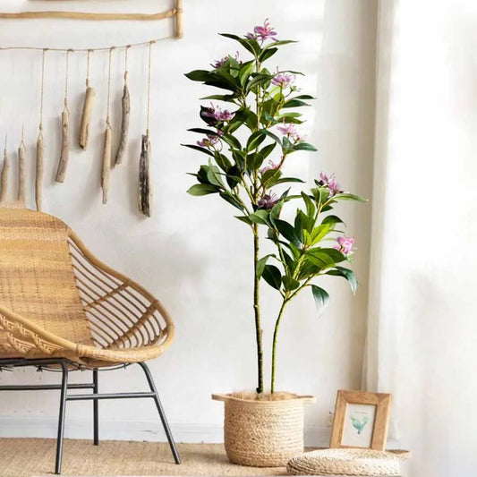 realistic artificial magnolia tree for living room in woven basket faux plant by Nutshell near rattan chair