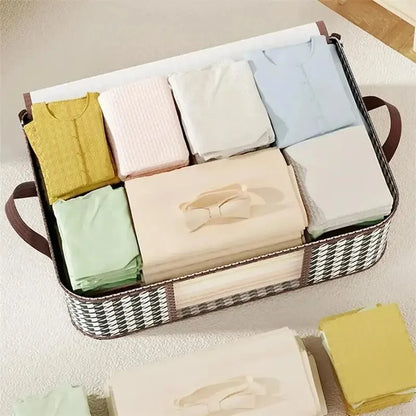 Foldable woven storage with handles neatly holding folded clothes and a beige dust proof organizer box for wardrobe organization