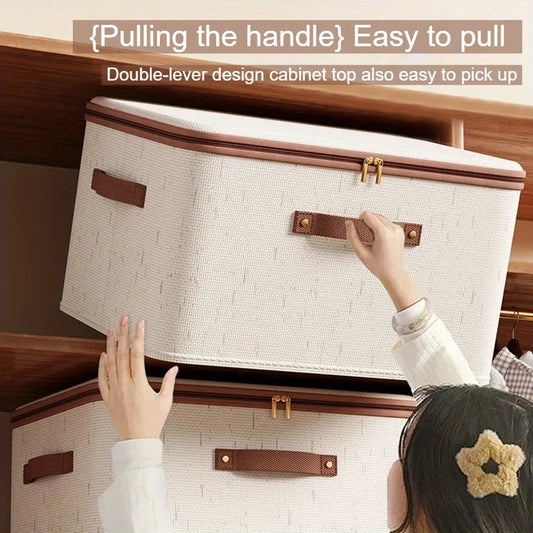 Person pulling handle on beige linen box with brown trim stacked in shelf Large Capacity Linen Storage Boxes