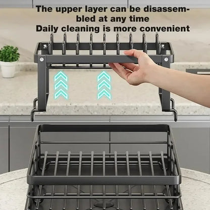 Nutshell adjustable dish drying rack with removable upper tier being lifted by hand over lower tray