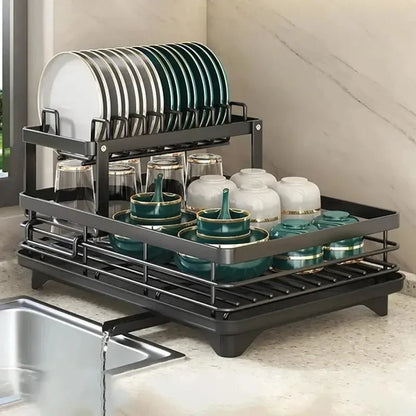 Nutshell black two tier adjustable dish drying rack on countertop holding plates bowls glasses and cups