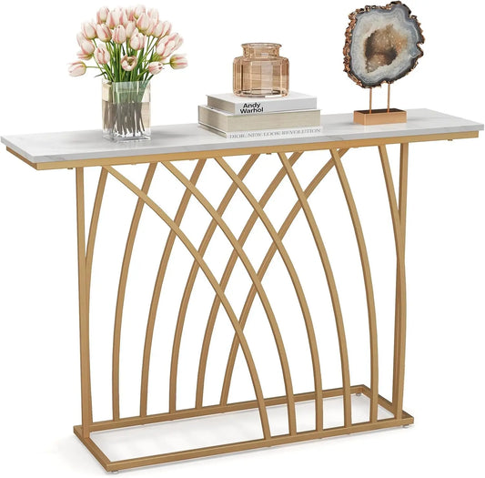 Nutshell modern gold console table with white marble top and arched gold metal base styled with tulips and geode decor