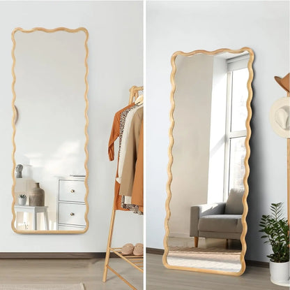 Nutshell rectangular wooden frame mirror full length scalloped edge leaning against wall in bedroom
