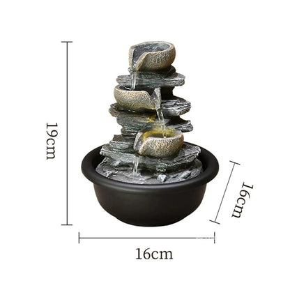 Nutshell indoor tabletop water fountain with layered rock design and LED lighting in black base