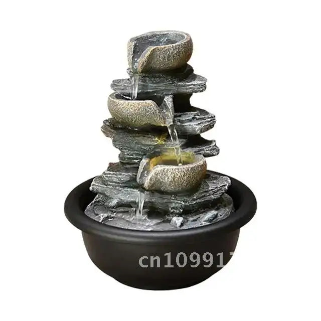 Nutshell indoor tabletop water fountain with cascading stone bowls and black round base