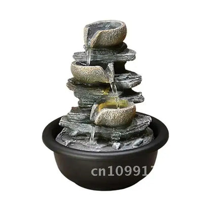 Nutshell indoor tabletop water fountain with cascading stone bowls and black round base