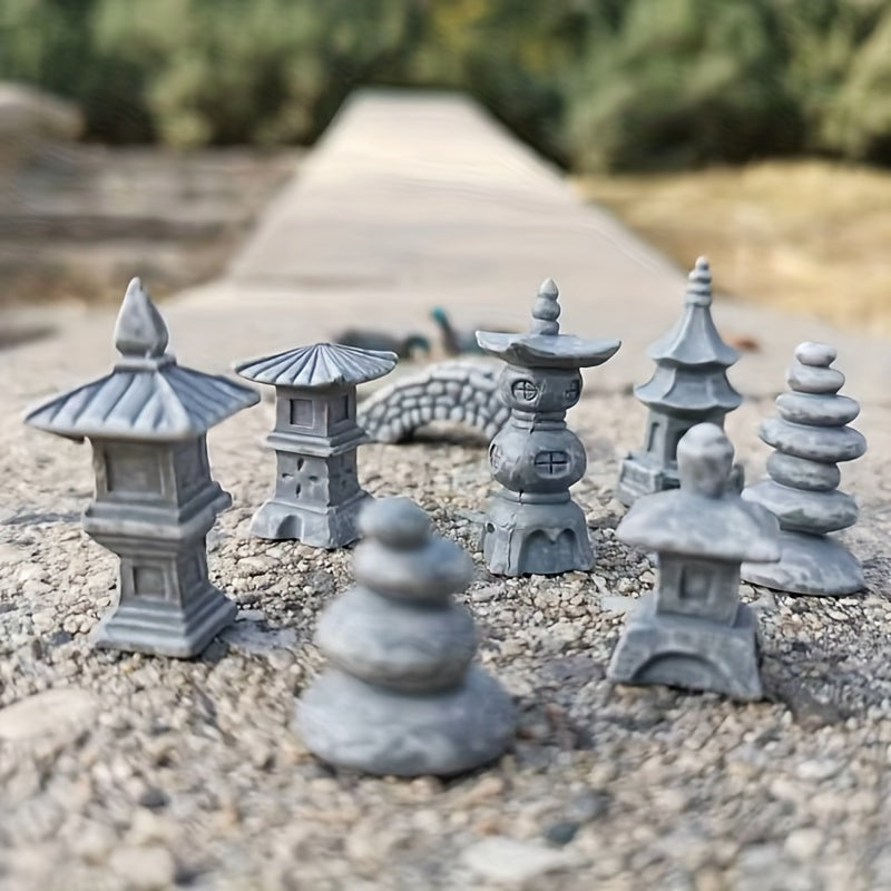 Miniature Japanese zen garden bridge models with various stone sculptures for decorative landscaping