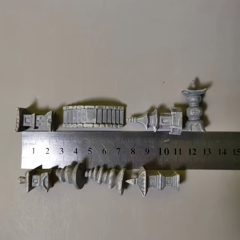 Various Japanese zen garden bridge models arranged next to a ruler for size comparison