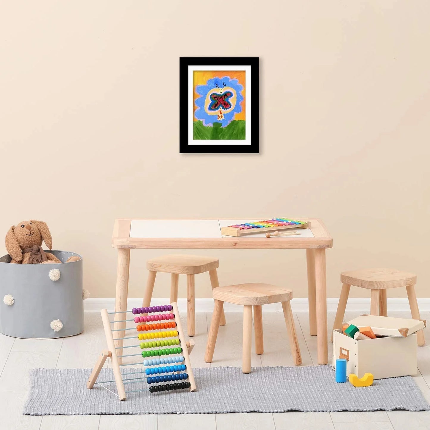 Nutshell kids art frames with magnetic front displayed in a colorful playroom setting