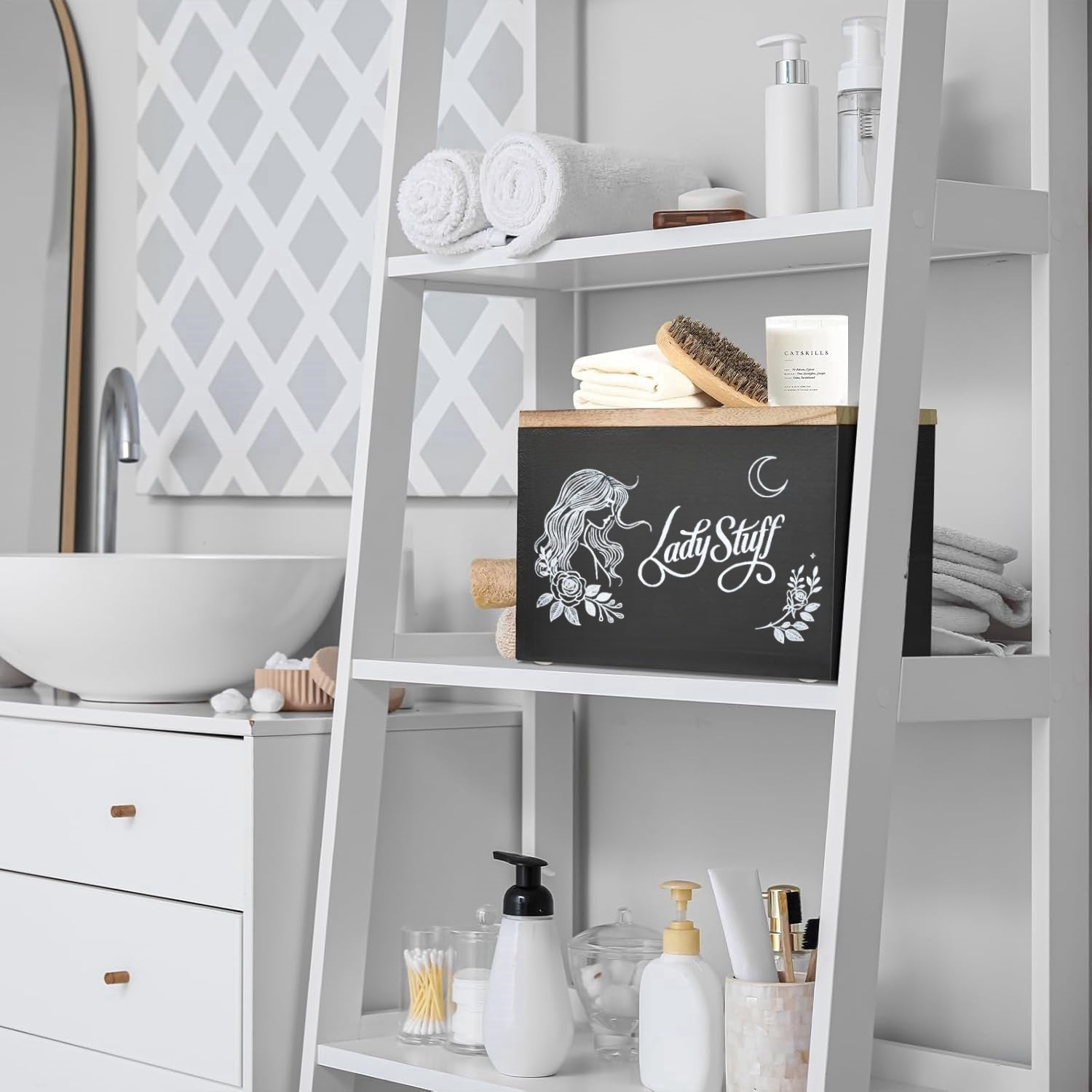 Nutshell lady stuff storage container on a bathroom shelf with towels and toiletries