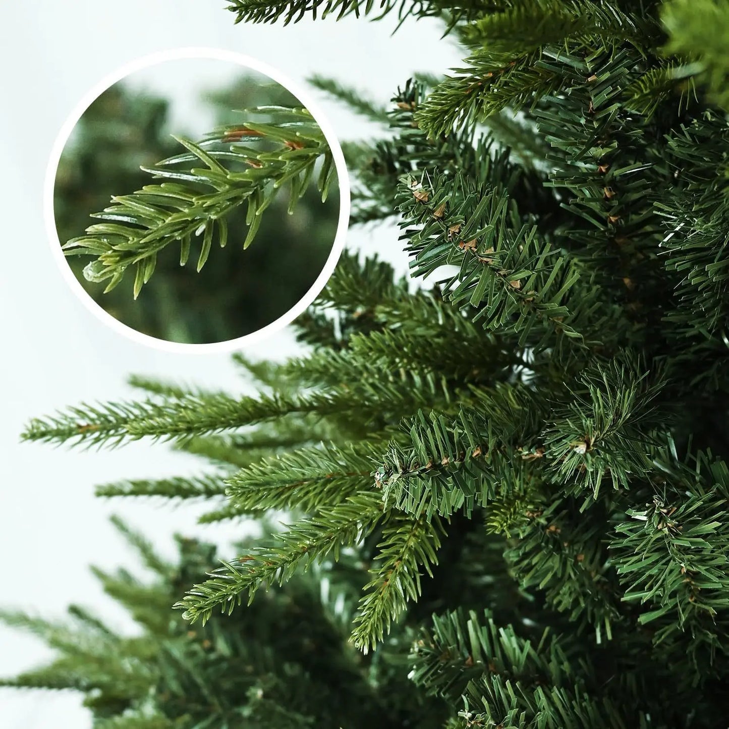 Close-up of large artificial Christmas tree branches showcasing lush and realistic green needles
