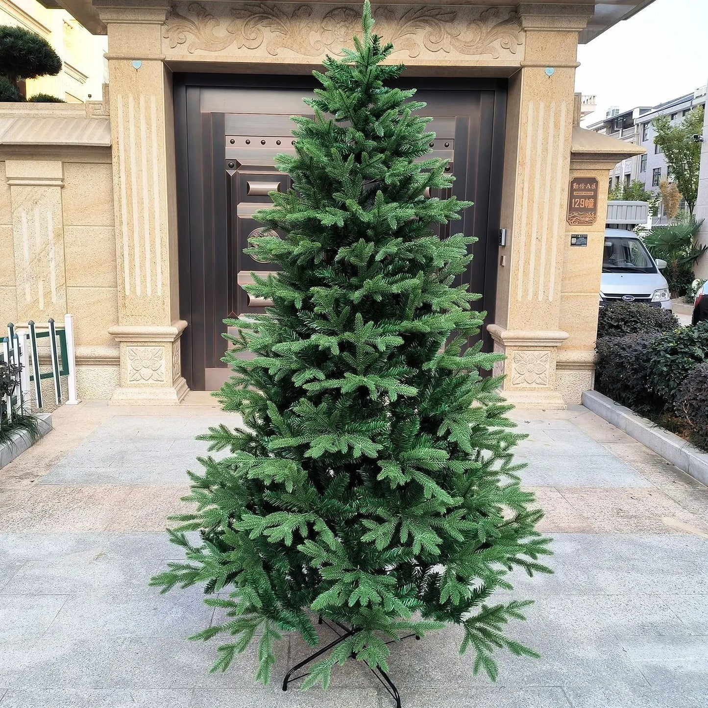 Large artificial Christmas tree with lush green branches perfect for holiday decorations