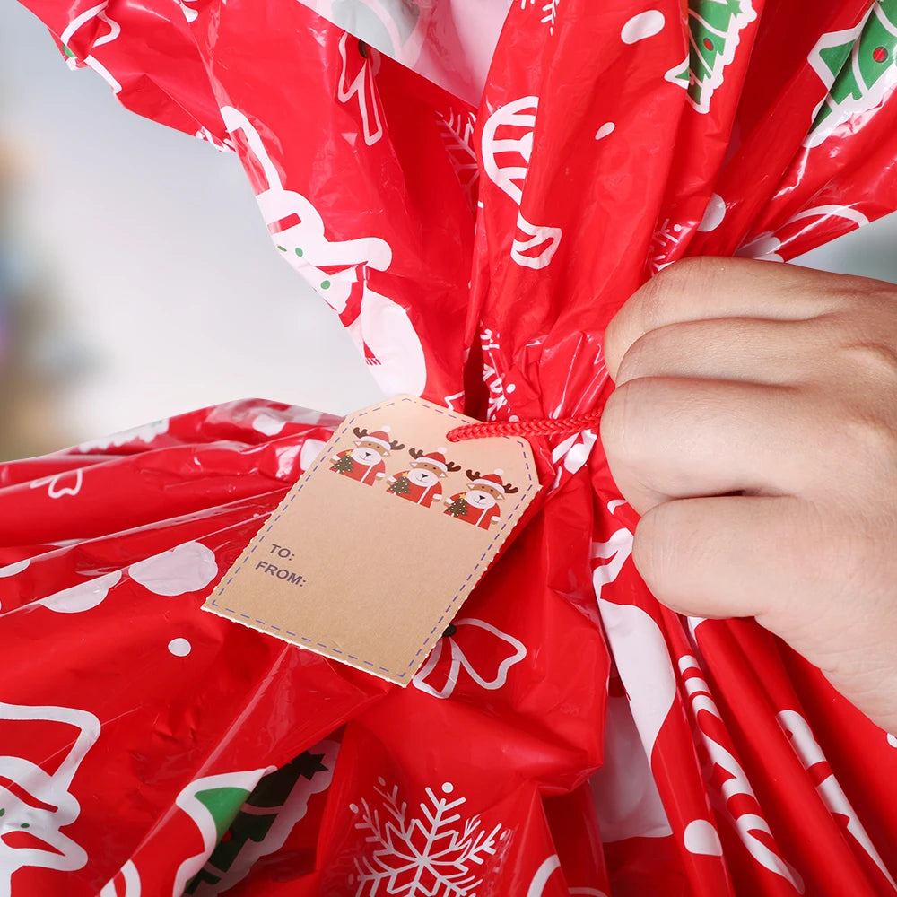 Large Christmas gift bag in festive red with snowflakes and Santa designs, perfect for holiday gifting