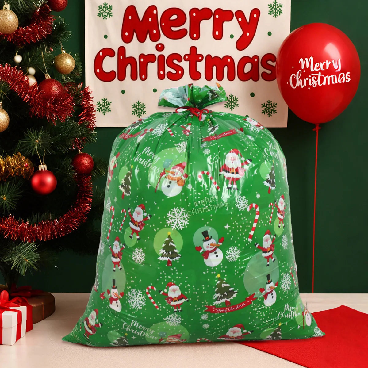 Large Christmas gift bags in green with festive snowman design, perfect for holiday gifting