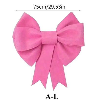 Large red bow made from soft fabric, perfect for gifts and decorations with a classic design