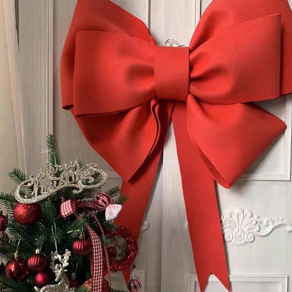 Large red bow with flat ribbons, perfect for decorating gifts or holiday trees