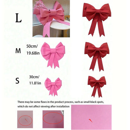 Large red bow in three sizes with variations in pink and red colors for festive decorations