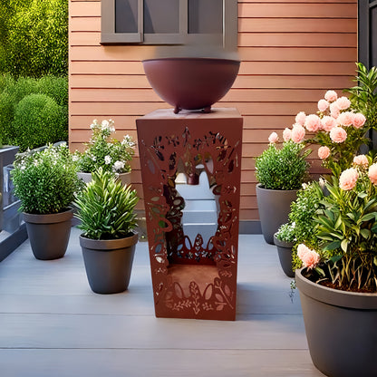 Large red iron flower pot positioned elegantly among vibrant plants on a patio