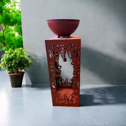 Large red iron flower pot with intricate cut-out design perfect for indoor or outdoor plants