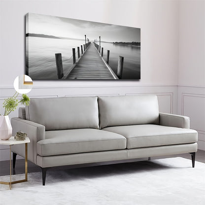 Large vintage bridge canvas art featuring a serene black and white waterfront scene