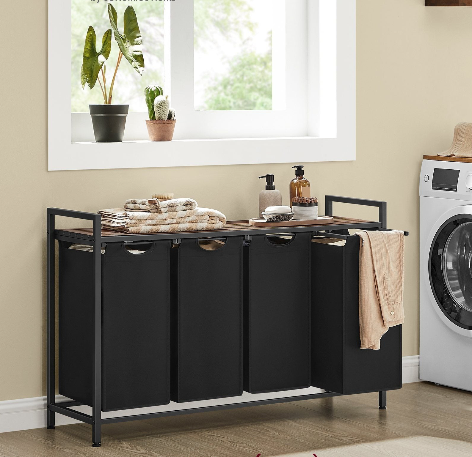 Nutshell laundry sorter with 4 removable bags, featuring a stylish design for easy laundry organization